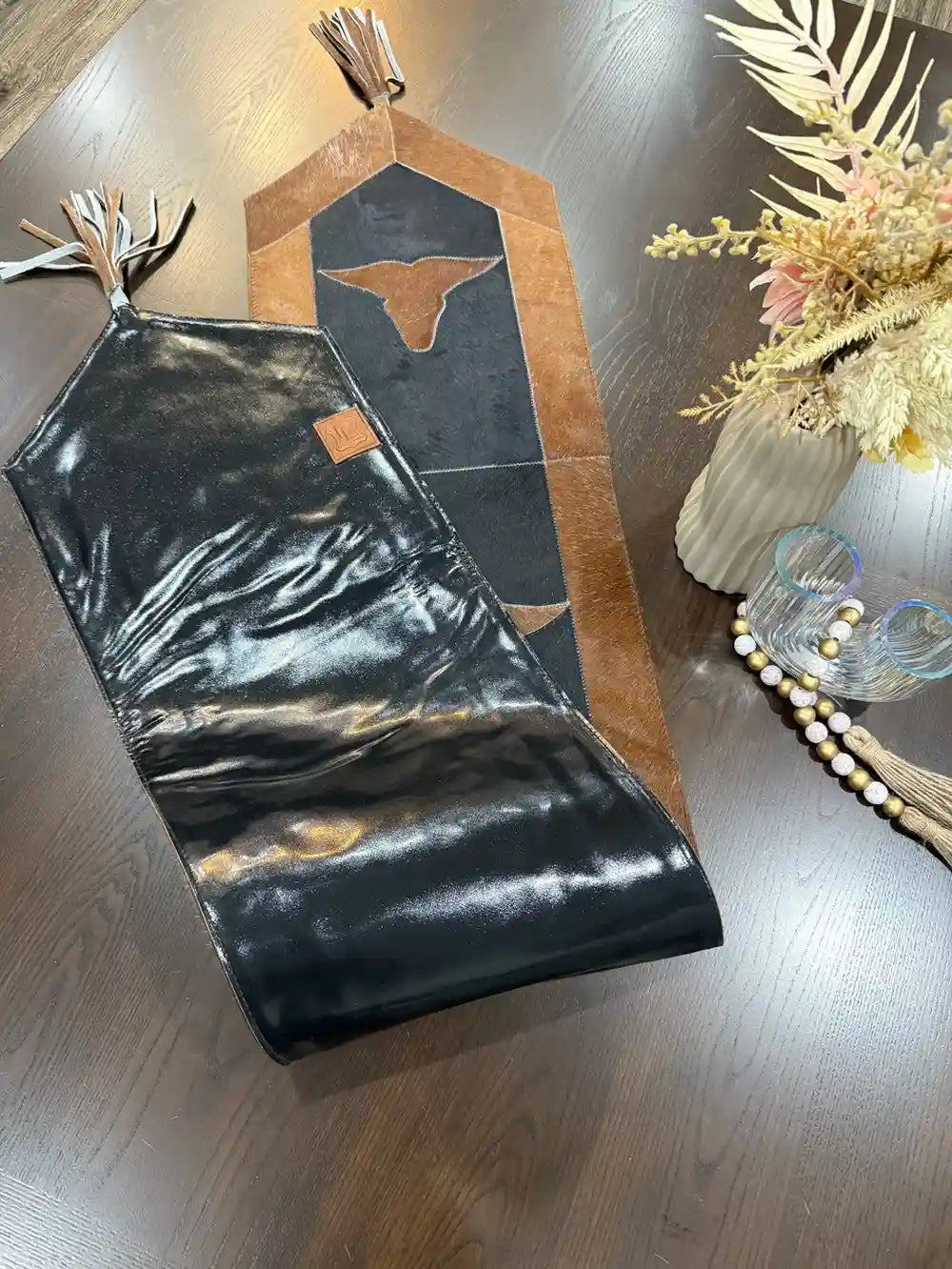 Cowhide bullhead table runner with bullhead patch, having leather fringes