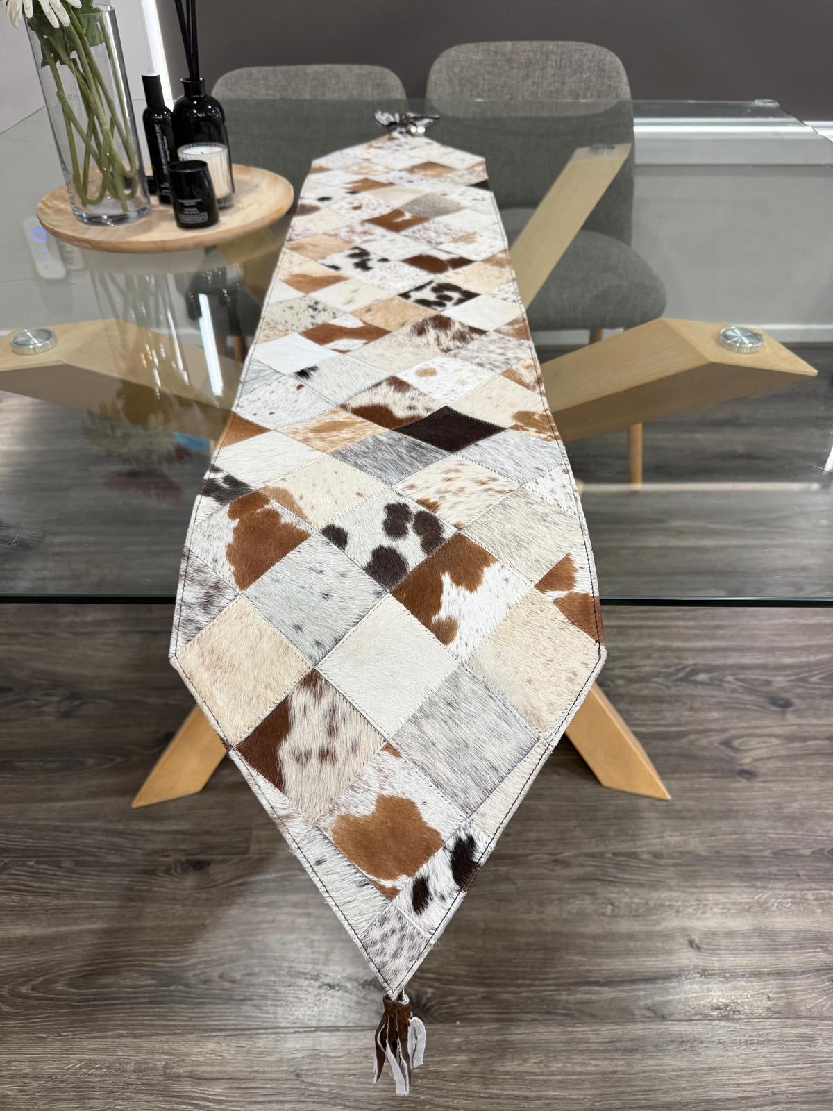 Table runner with cowhide pattern on a dining table