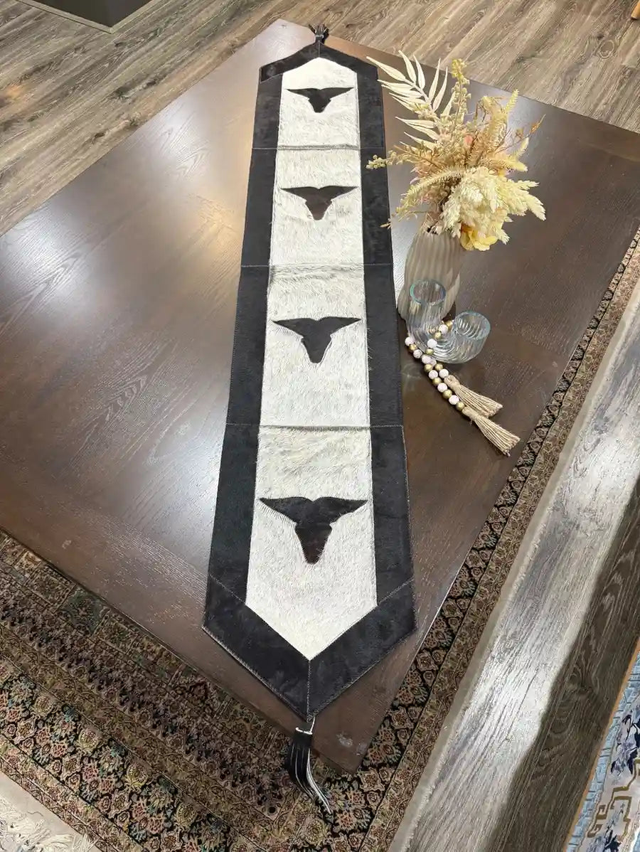 Cowhide bullhead table runner with bullhead patch, having leather fringes