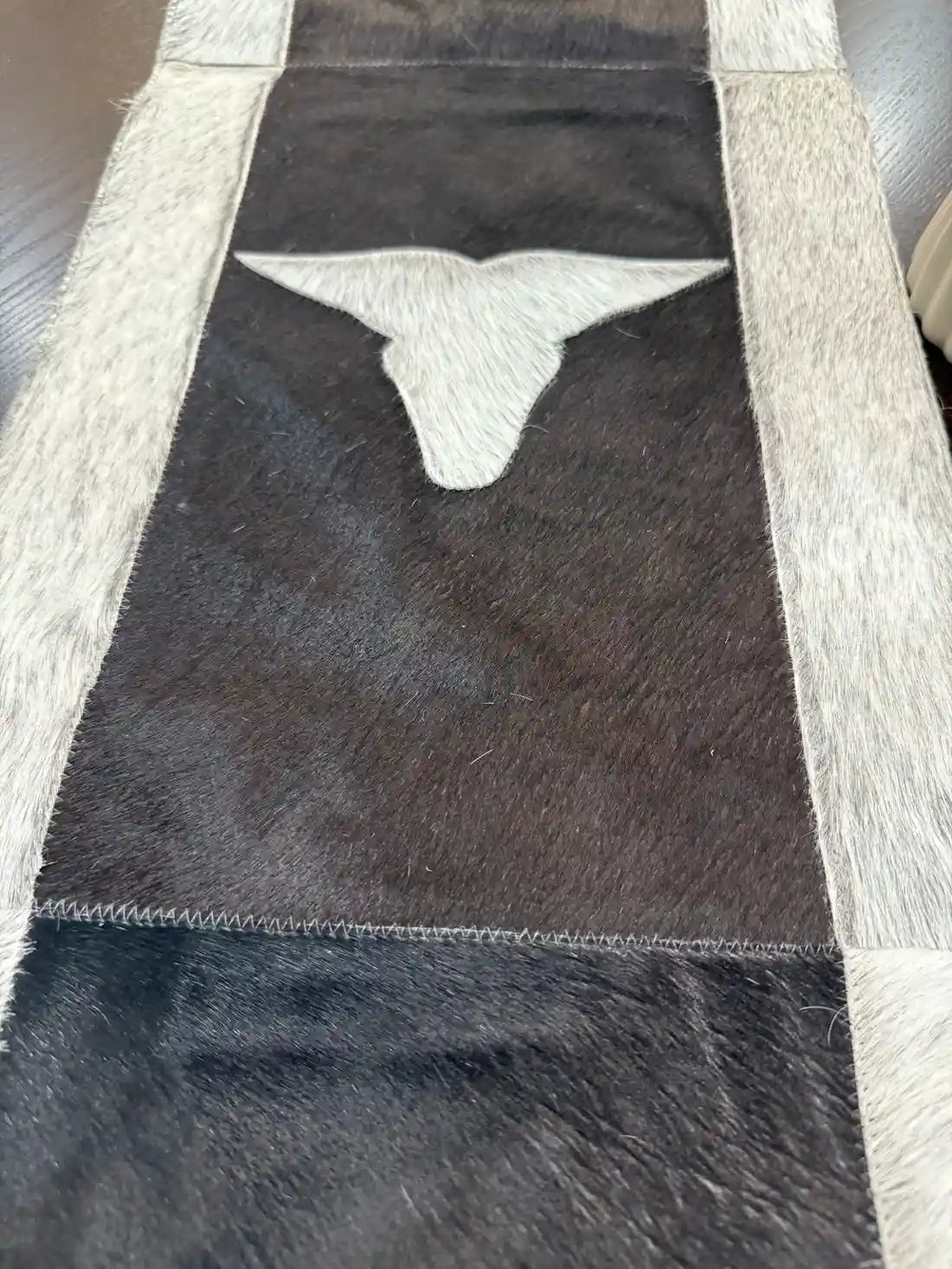 Cowhide Leather table runner with bull head leather patch, having leather fringes