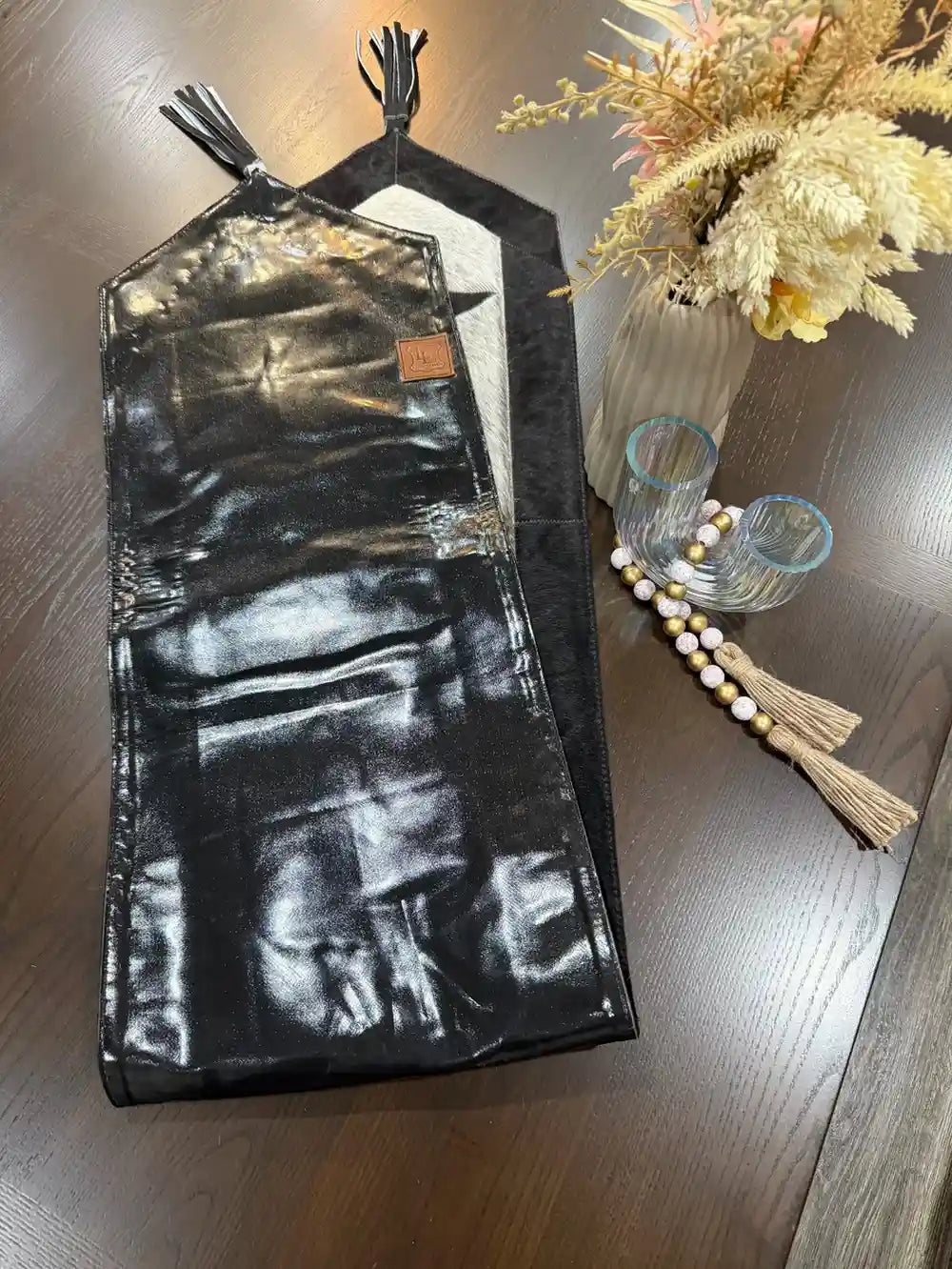 Cowhide bullhead table runner with bullhead patch, having leather fringes
